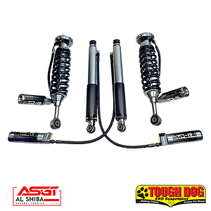 Four metal shock absorbers with black coil springs, part of an off-road suspension kit, featuring Tough Dog and AL Shiba branding.